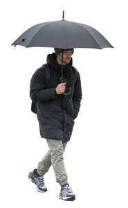 man walking on a cold rainy day