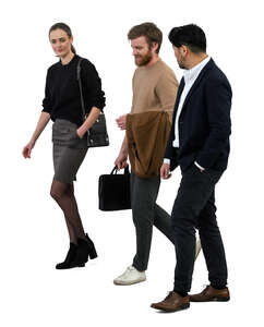 three modern office workers walking together