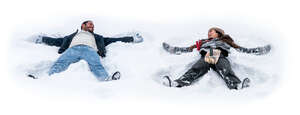 man and woman lying in the snow