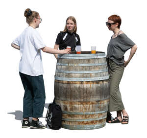 three women standing in a casual outdoor bar