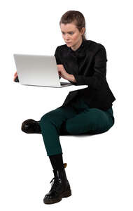 woman sitting at the table and working with computer