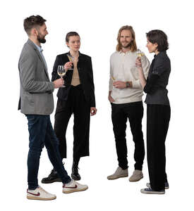 group of people standing and drinking wine and talking