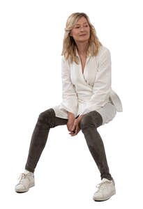 woman wearing a white blouse sitting