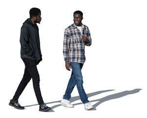 two black men walking and talking