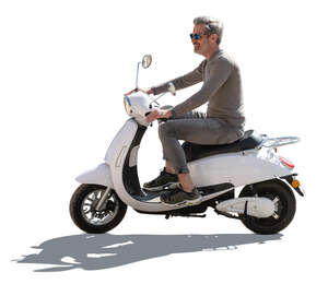 cut out backlit grey haired man riding a white motor scooter