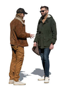 two cut out men standing outside on sunny autumn day and talking