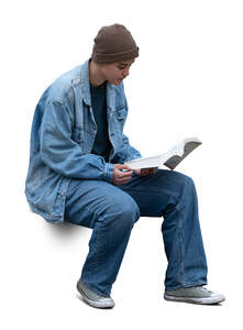 cut out college student sitting and reading a book