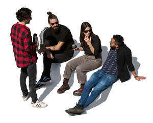 group of four people sitting and drinking mate tea seen from above