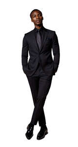 black man wearing a black suit standing