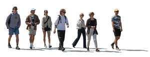 group of backlit young people walking