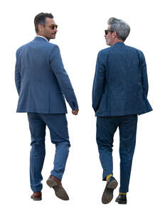 two cut out men in suits walking