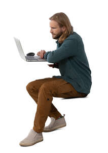 man sitting behind a computer
