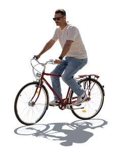 cut out backlit man riding a bicycle