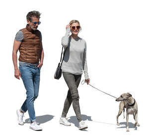 cut out man and woman walking a dog