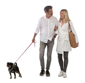 cut out happy middle aged couple walking a dog