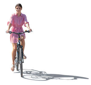 cut out backlit woman in a striped dress riding a bike
