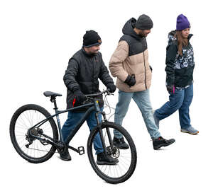 group of three people walking in winter seen from above