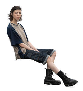 cut out woman in tank boots sitting
