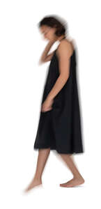 cut out motion blur image of a woman in a black dress walking down the stairs