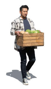 asian man carrying a box full of vegetables