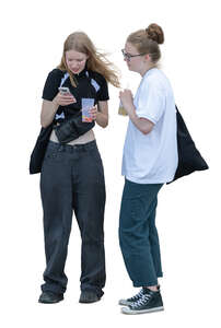 two cut out young women standing and looking at a phone