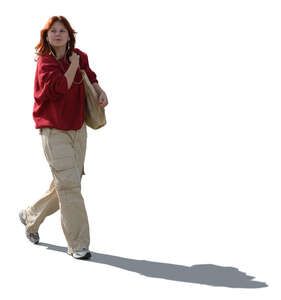 backlit teenage girl walking