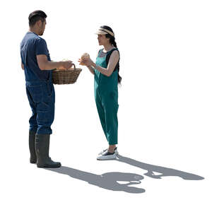 two backlit asian garden workers standing