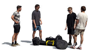 four young men with many bags standing