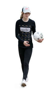 cut out teenage girl holding a ball and walking