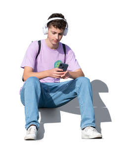 cut out teenage boy sitting and listening to music