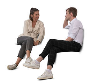 cut out man and woman sitting on a sofa and talking