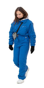cut out woman in a blue winter ski costume walking