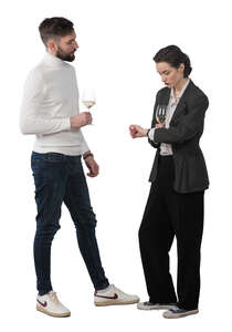 two people standing and drinking wine