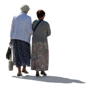 two cut out backlit older ladies walking