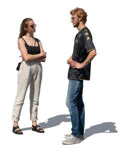 two people standing and talking