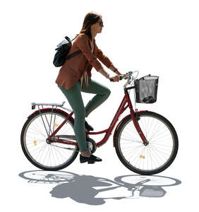 cut out backlit woman riding a bike