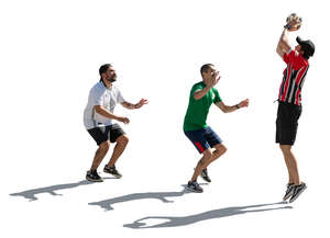 cut out backlit group of men playing basketball