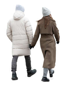 cut out man and woman in winter walking hand in hand