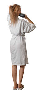 cut out woman in a bathrobe drying her hair