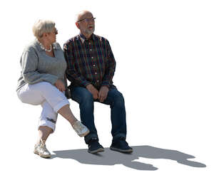 cut out backlit elderly couple sitting