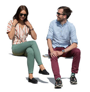 two cut out people sitting