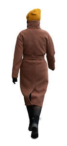 woman in a brown overcoat walking