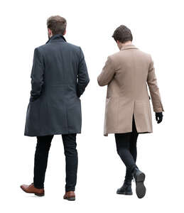 two men wearing overcoats walking