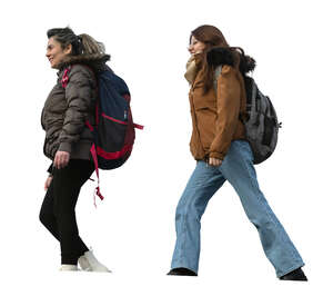 two cut out women walking seen from below