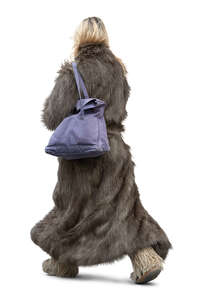 cut out woman in a fur coat walking