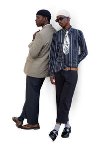 two cut out black men standing and leaning against the wall