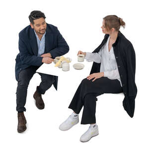cut out top view of two people sitting in a cafe