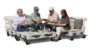 group of senior friends sitting having a garden party