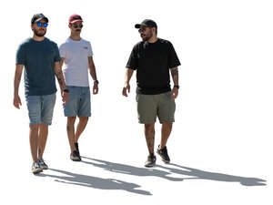 backlit group of men walking