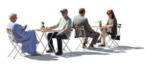 cut out backlit group of people sitting in a restaurant